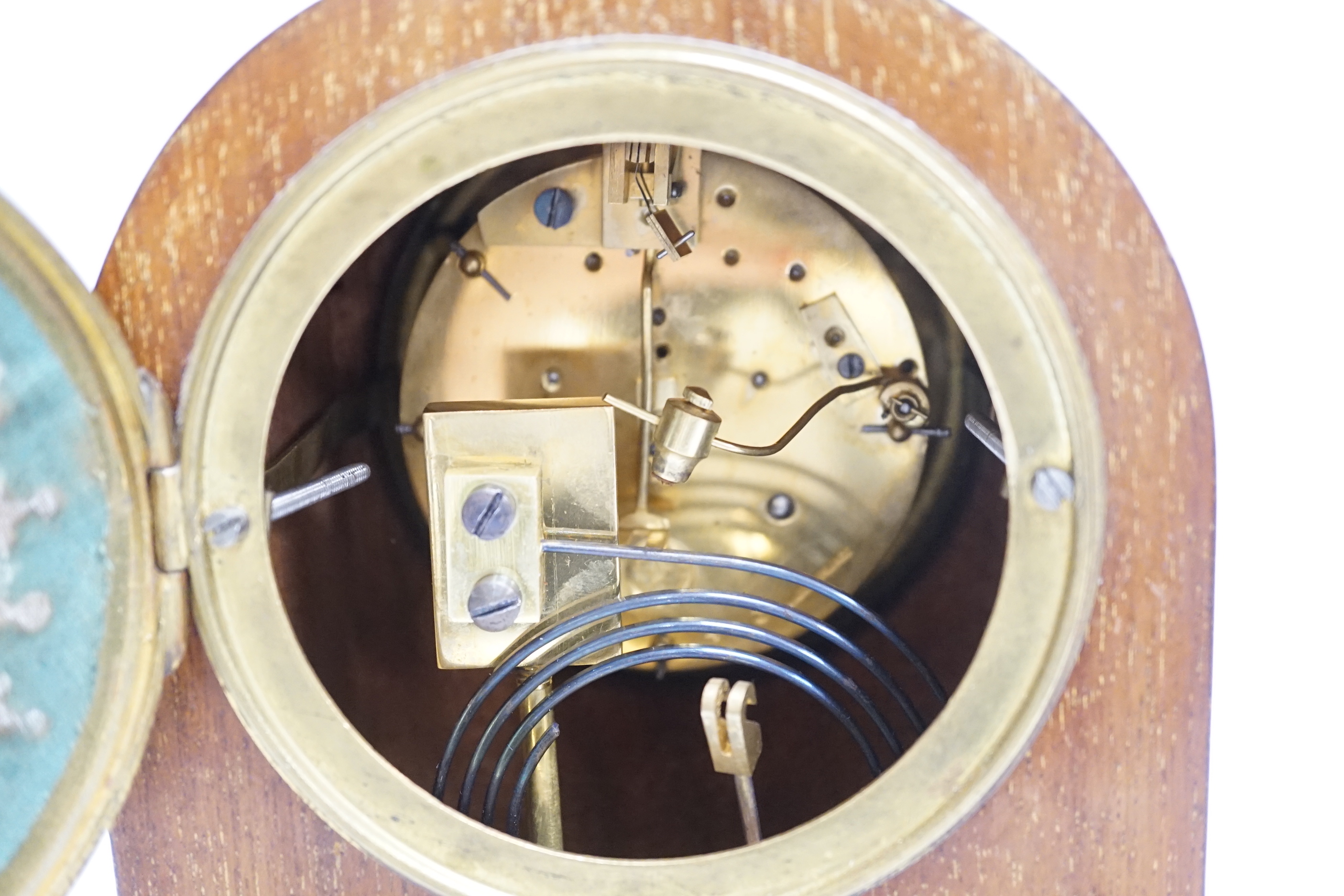 An Edwardian marquetry mantel clock with enamel dial, the case inlaid with swags, 26cm high